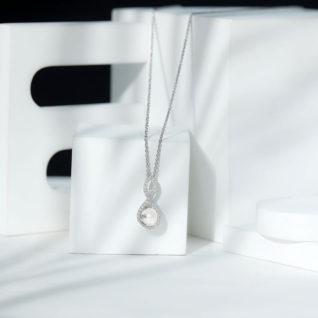 Freshwater White Pearl and Moissanite Infinity Pendant in Silver