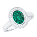 1.2 Carat Oval Lab Grown Emerald Bezel Set Engagement Ring With Diamond Halo