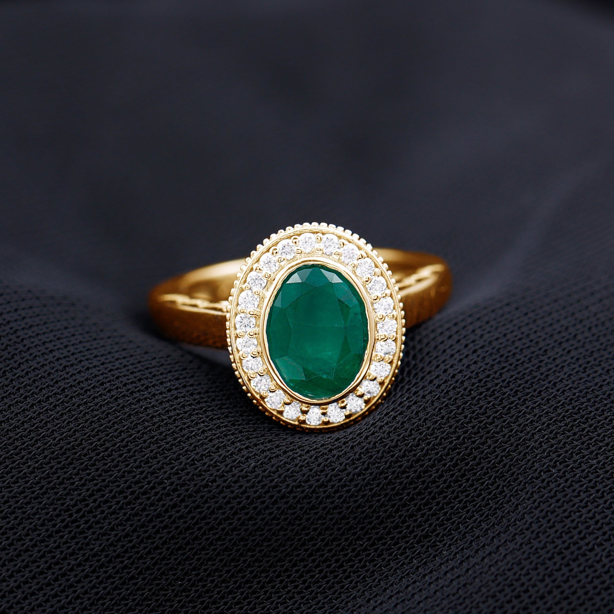 1.2 Carat Oval Lab Grown Emerald Bezel Set Engagement Ring With Diamond Halo