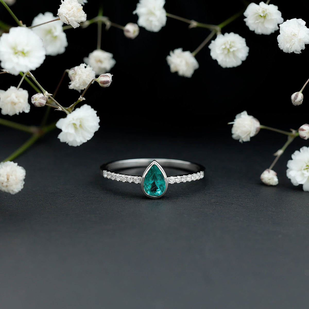 Pear Shaped Emerald Engagement Ring with Diamond Side Stones