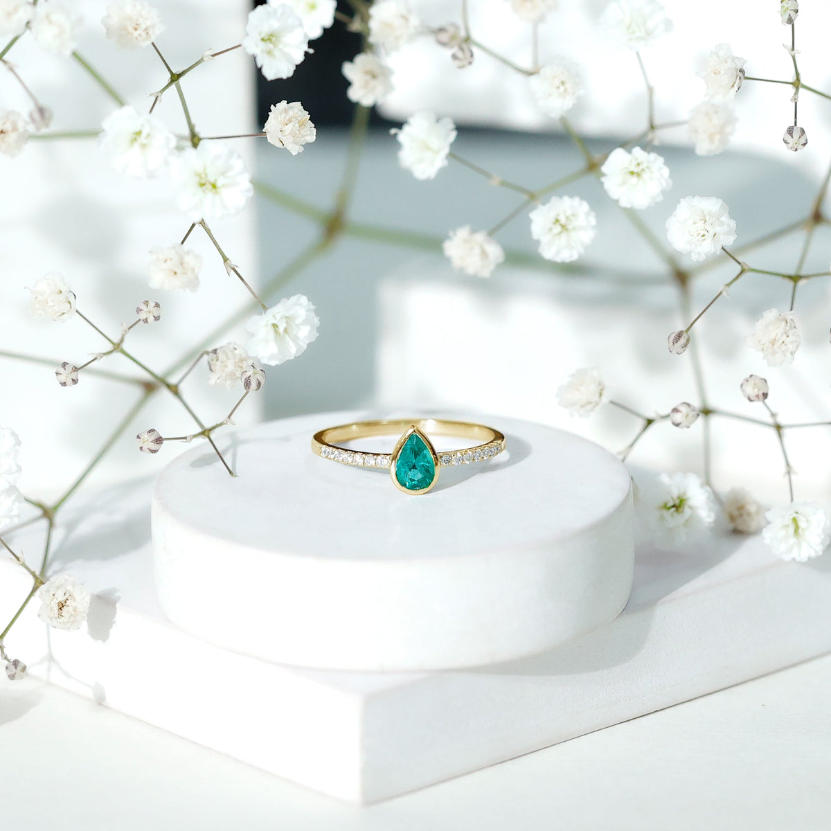 Pear Shaped Emerald Engagement Ring with Diamond Side Stones